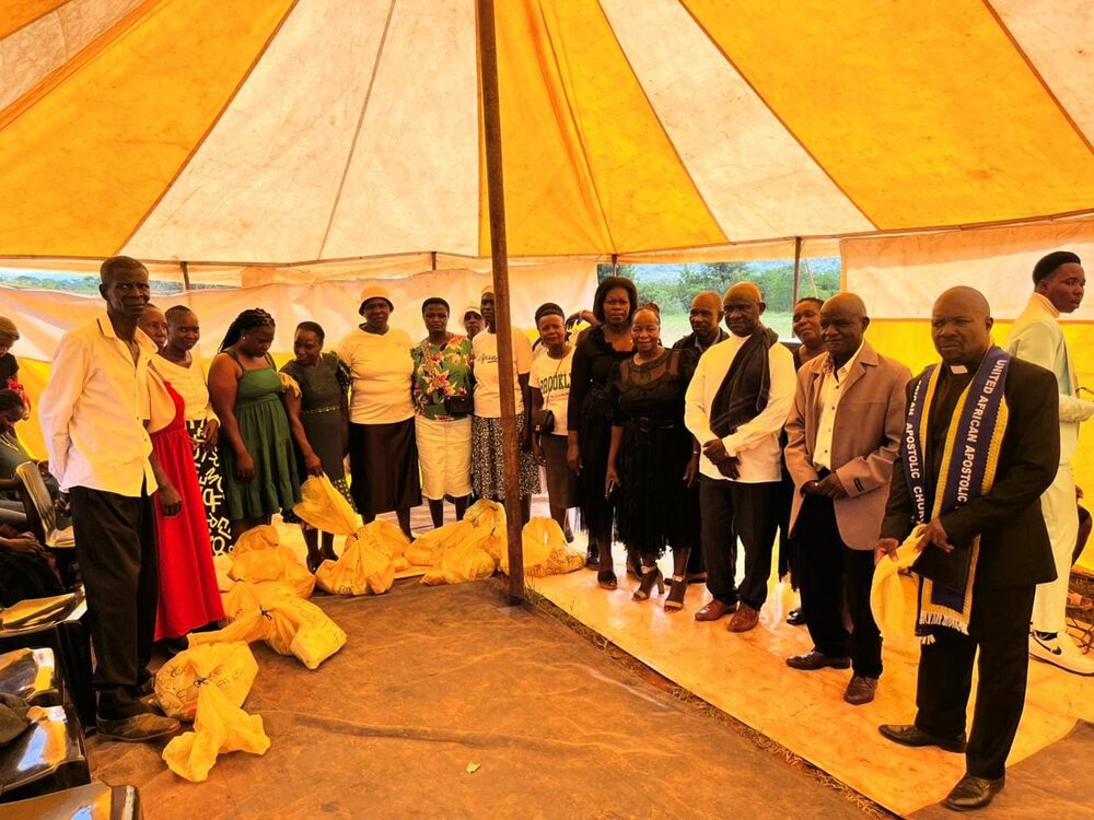 Handover of gifts to the community under the tent